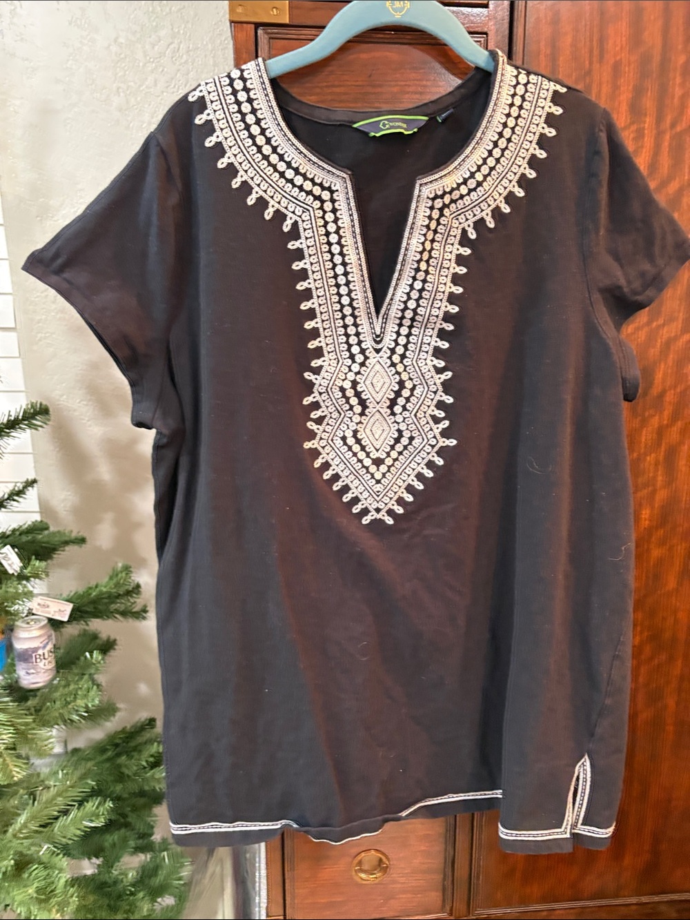 C. Wonder Black Tunic Top with White Embroidered Neckline